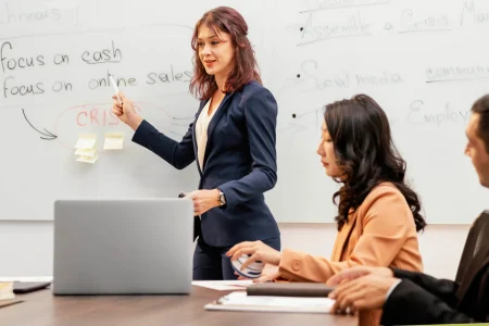 close-up-team-leader-explaining-board
